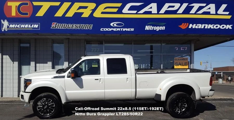 White crew-cab dually pickup at Tire Capital in Prince George. Fitted: Cali-Offroad Summit 22x8.5 (115ET/-192ET); Nitto Dura Grappler LT285/50R22