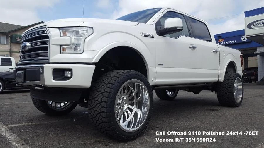 White lifted pickup at Tire Capital in Prince George. Fitted: Cali Offroad 9110 Polished 24x14 -76ET; Venom R/T 35/1550R24